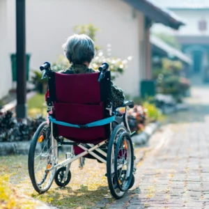 A person in a wheelchair on the street.