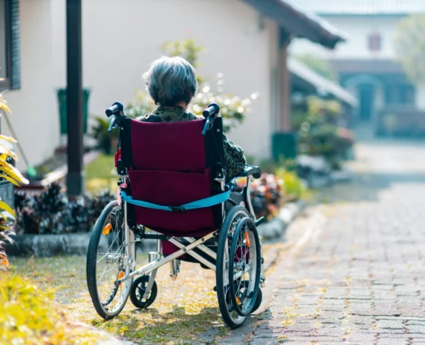 A person in a wheelchair on the street.