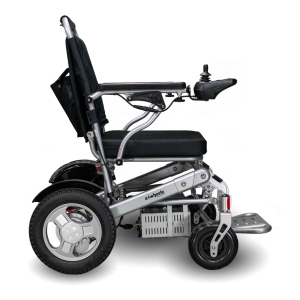 A black and silver wheelchair is parked on the ground