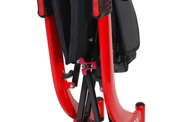 A red tripod with a black bag on top of it.