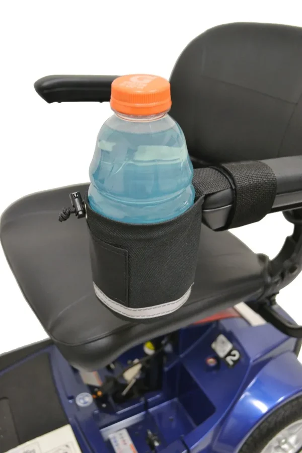 A bottle of water is sitting on the back of a wheelchair.