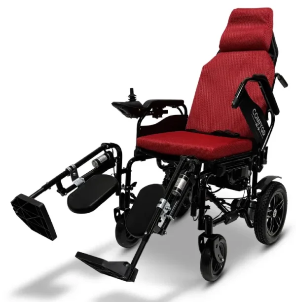 A red wheelchair with wheels and foot rests.