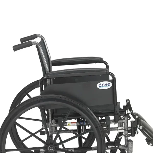 A wheelchair with the handle up and the back rest down.