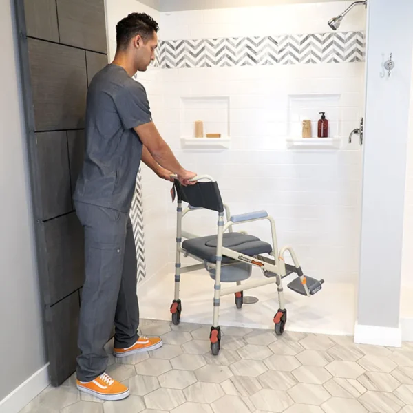 A man in grey shirt pushing a walker.