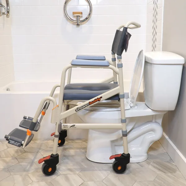 A toilet with wheels and a wheelchair on the back.