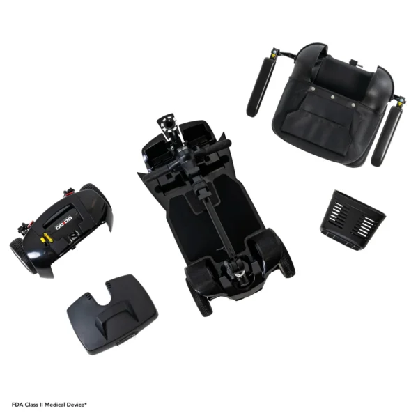 A black plastic device with various parts and accessories.