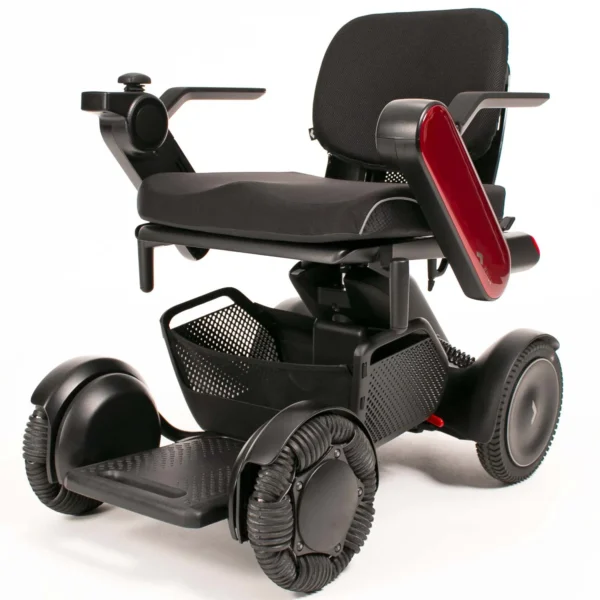 A black wheelchair with red accents on the seat.