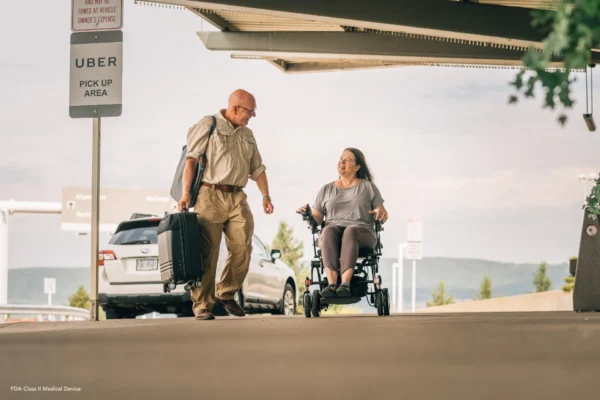 A man and woman walking down the street.