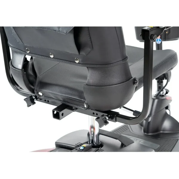 A close up of the seat and controls on a scooter.
