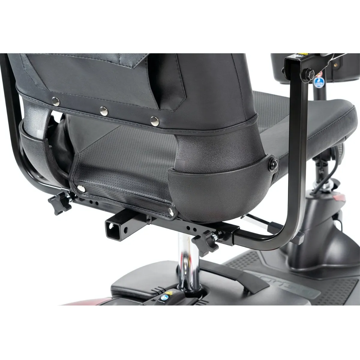 A close up of the seat and controls on a scooter.