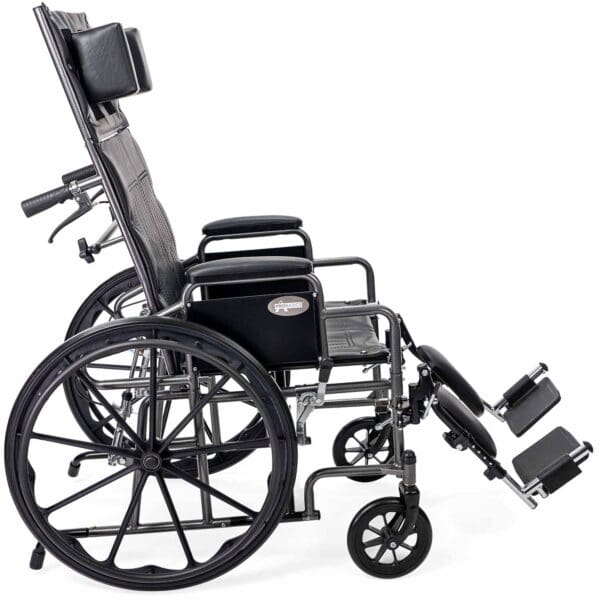 A wheelchair with the back reclined on it.