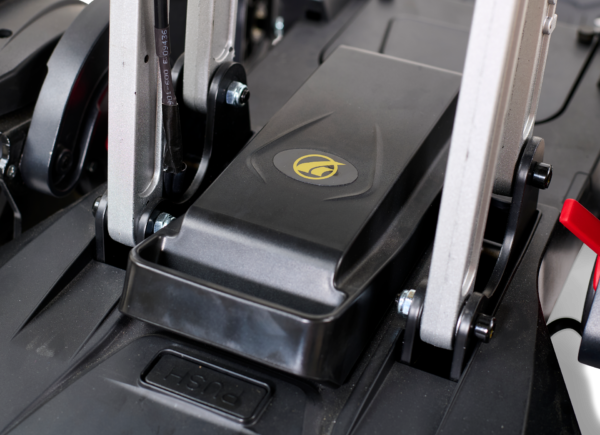 A close up of the foot rest on a gym machine