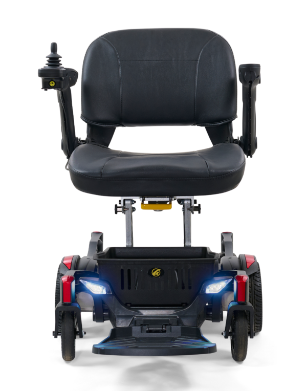 A black and red power chair with lights on it.