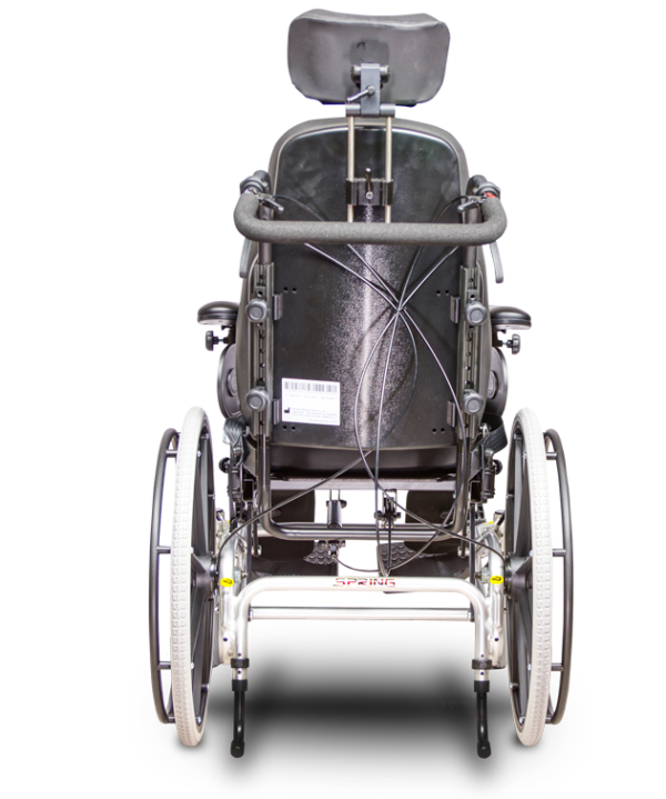 A back view of the back wheel of an electric wheelchair.