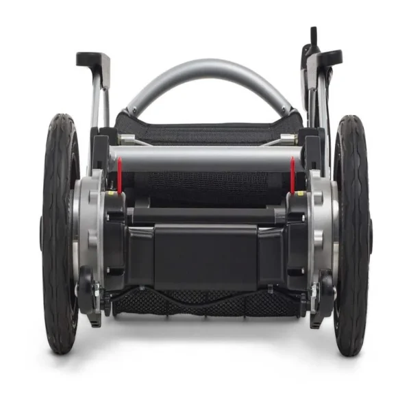 A rear view of the back wheel of an electric wheelchair.