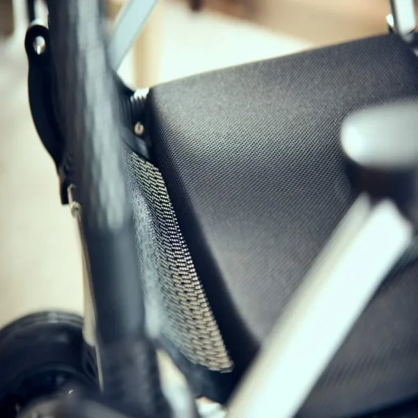 A close up of the seat on a wheelchair