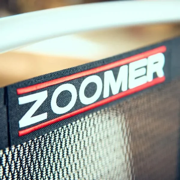 A close up of the zoomer logo on a chair.