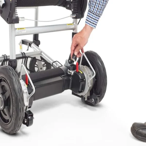 A person is using the battery to charge their electric wheelchair.