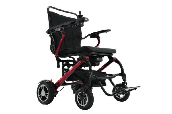 A black and red wheelchair is shown on a black background.